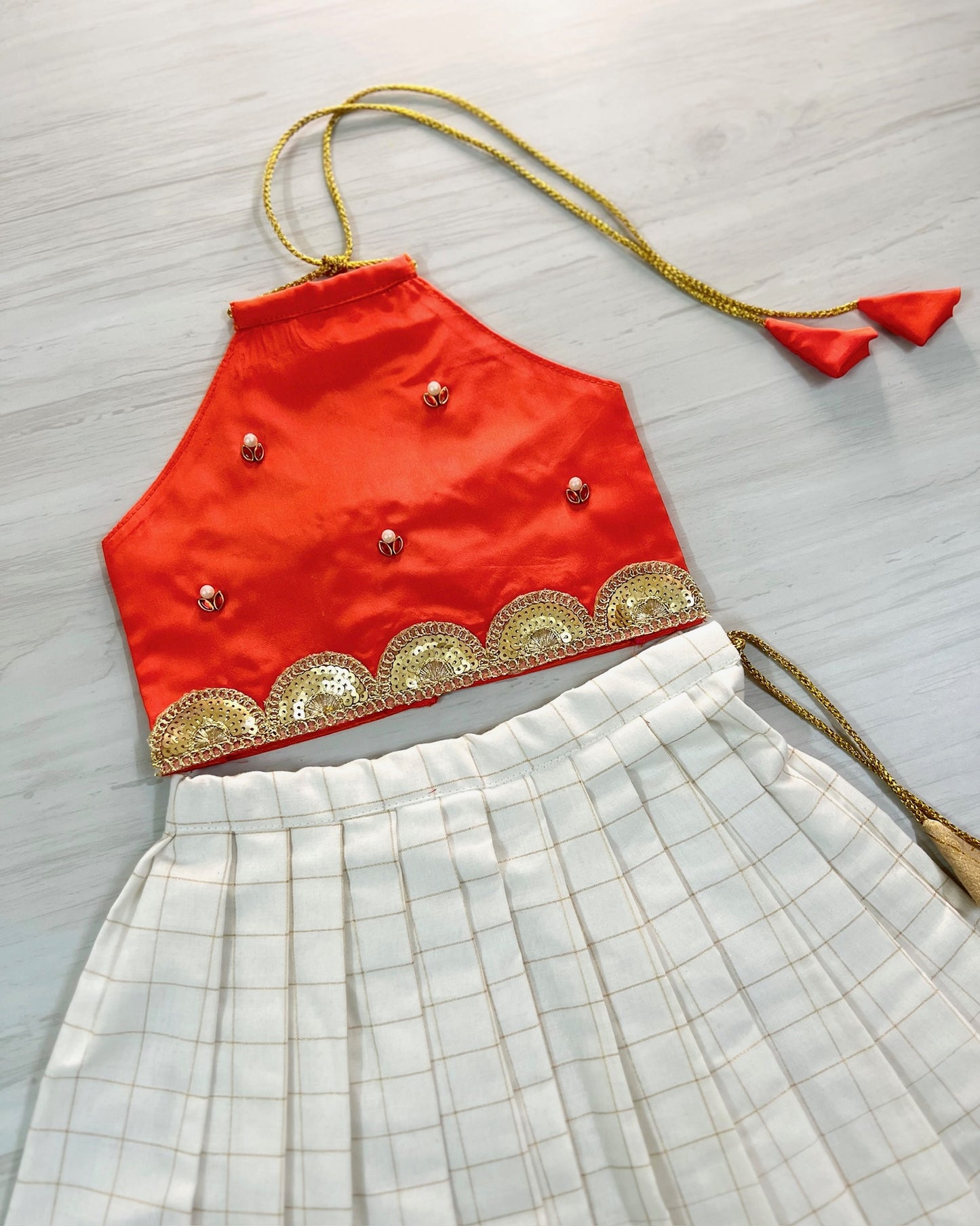 Fire Orange Halter Neck Top With White Cotton Pleated Skirt | The Silkberry