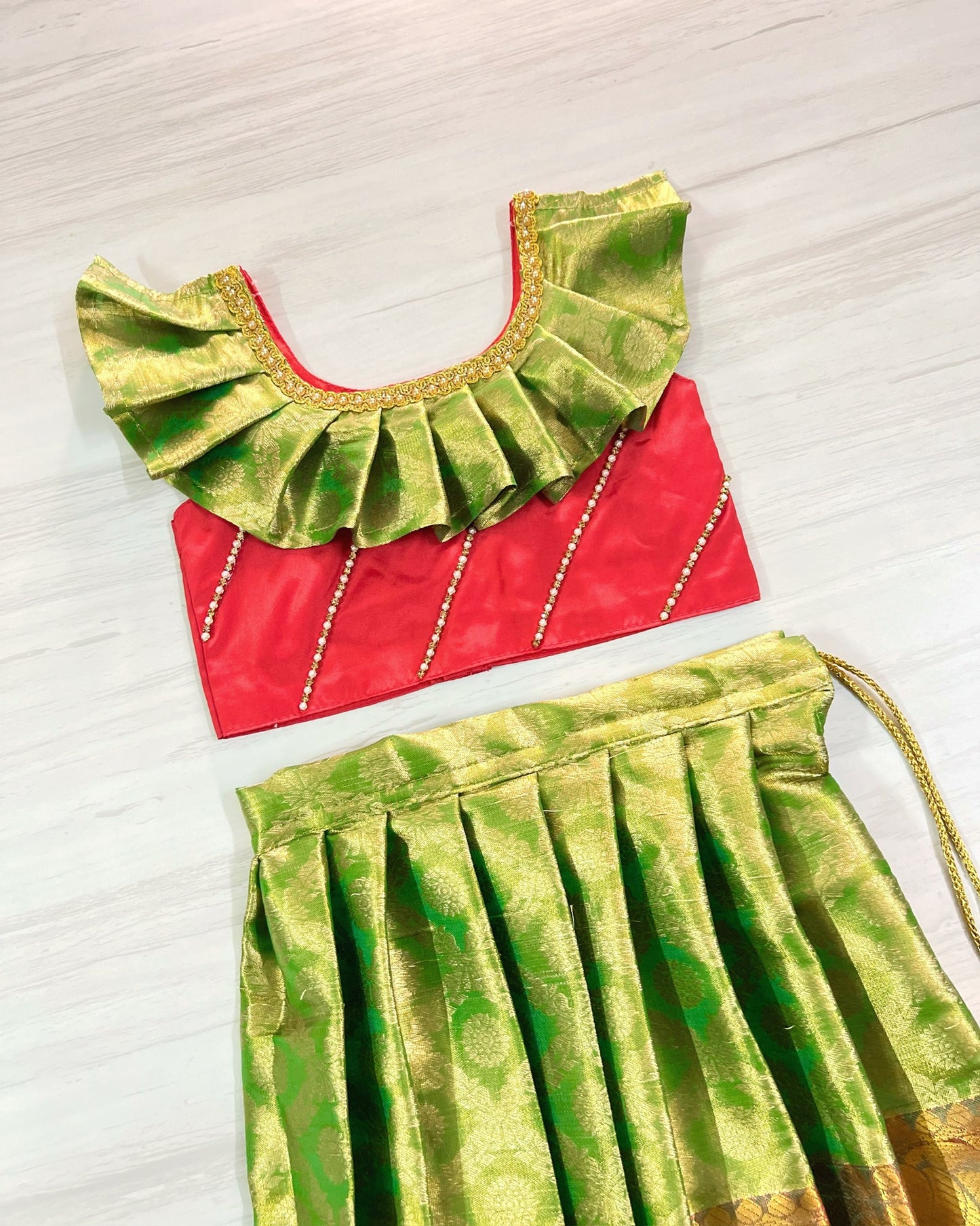 Cherry Red And Light Green Stone Embellished Pleated Silk Lehenga Set