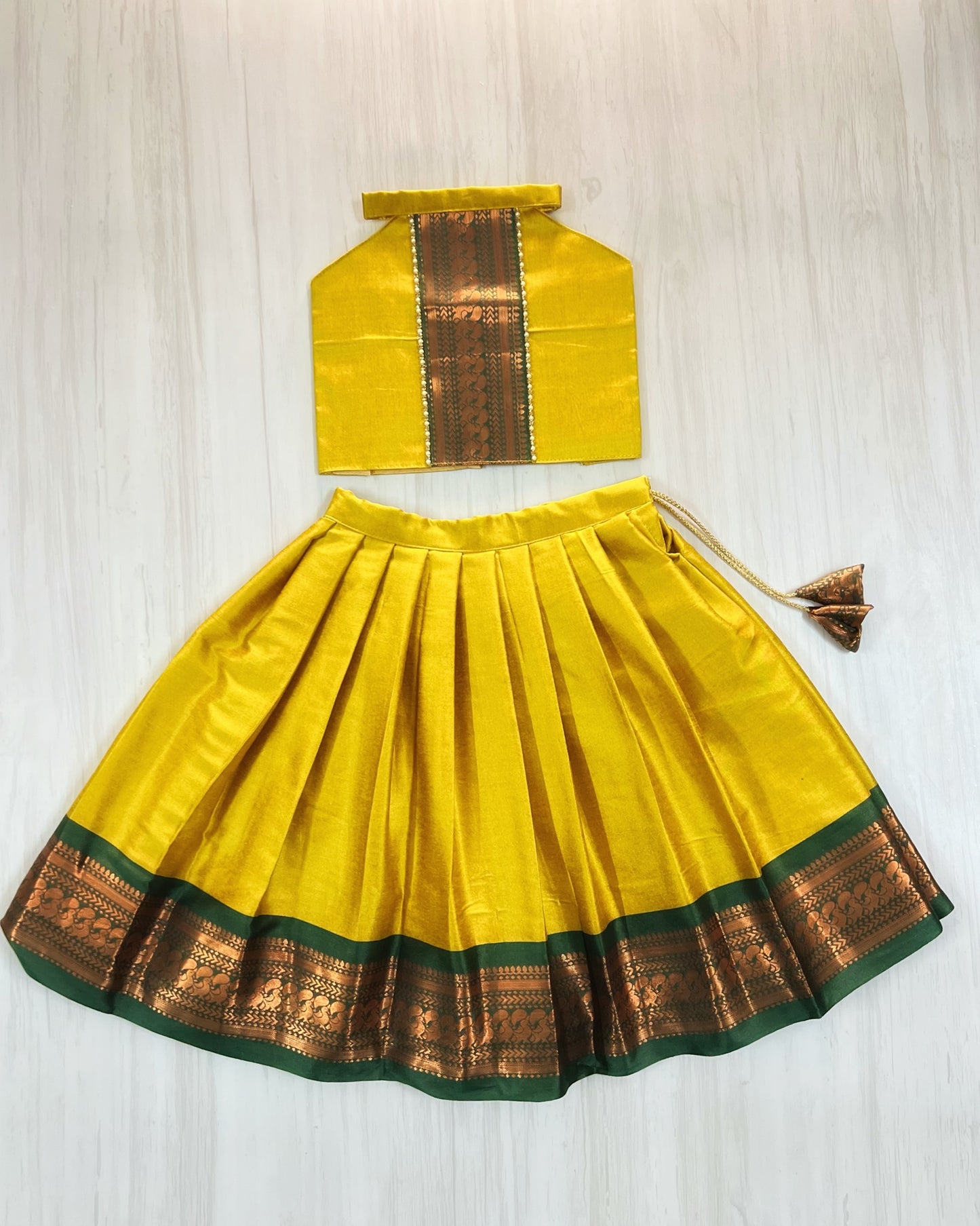 Auspicious Yellow With Emerald Green Halter Neck Lehenga Set