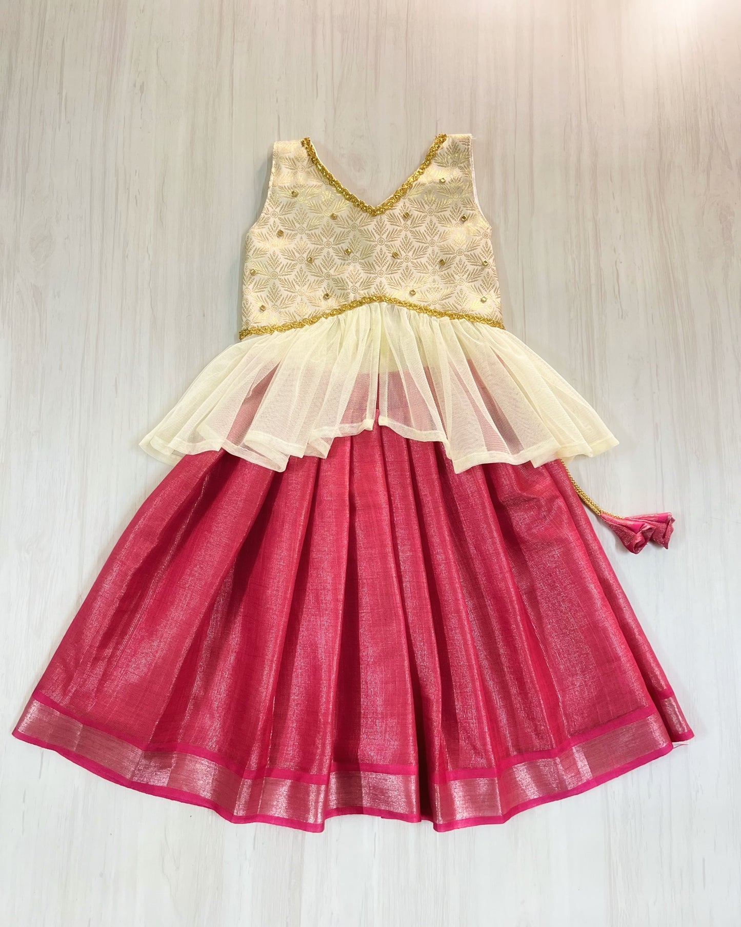 Rich Brocade Gold And Pink Netted Unique Lehenga Set