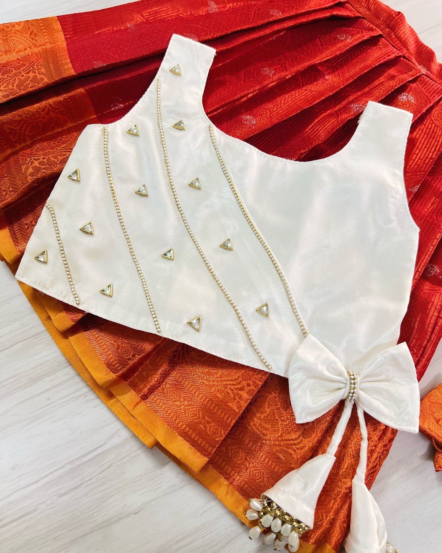 Pure White Embellished Top And Chilli Red Silk Skirt Lehenga Set