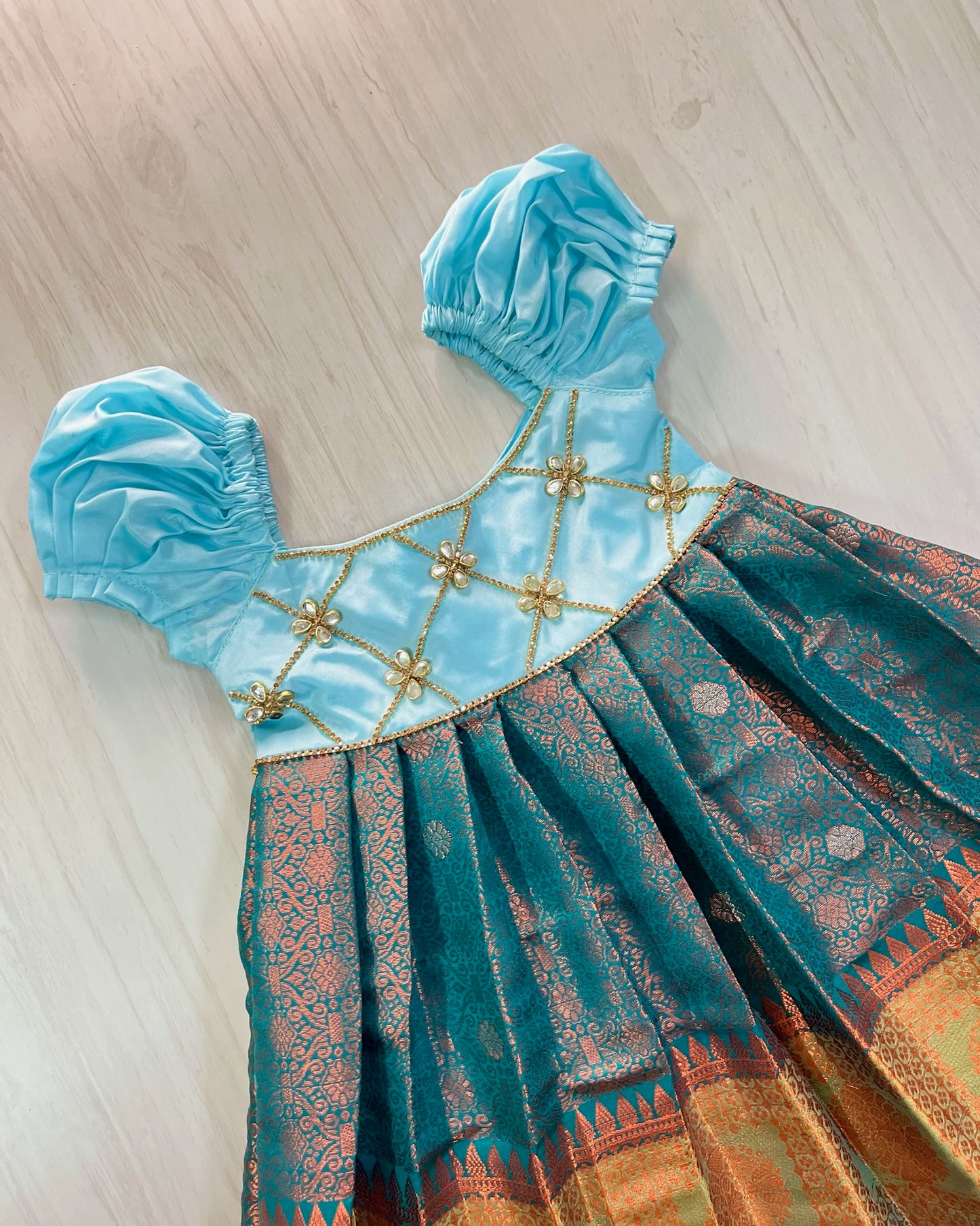 Sky Blue Criss Cross Stone Work Top With Teal Gown