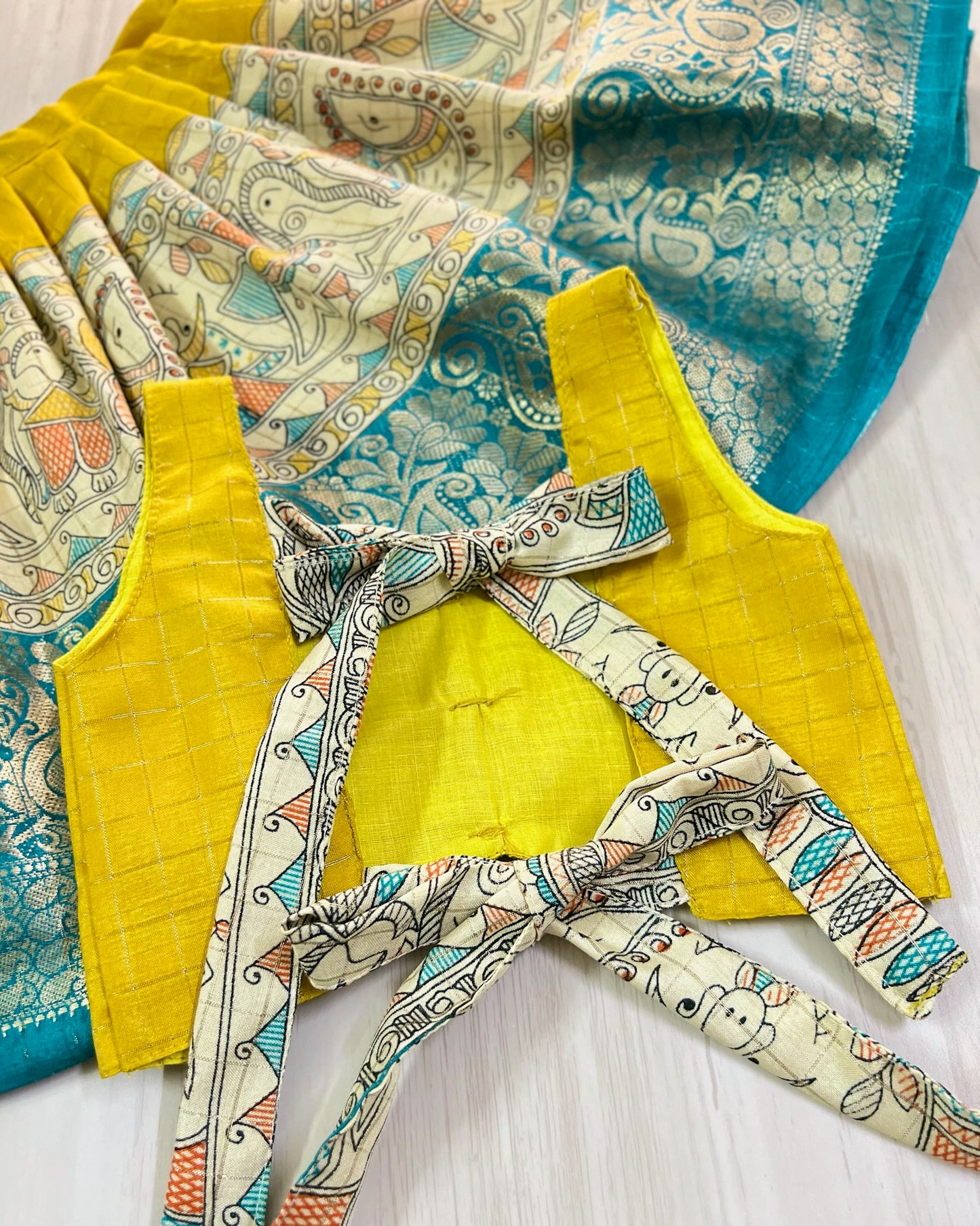 Breezy Yellow Cute Bow Tie Up Top With Pichwai Print Skirt