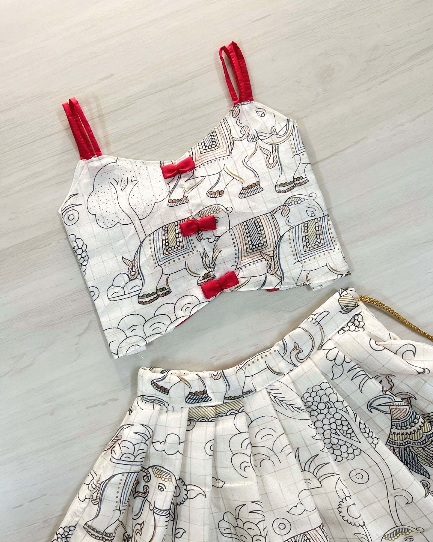 Porcelain White With Cute Red Bows Tie-Up Lehenga Set