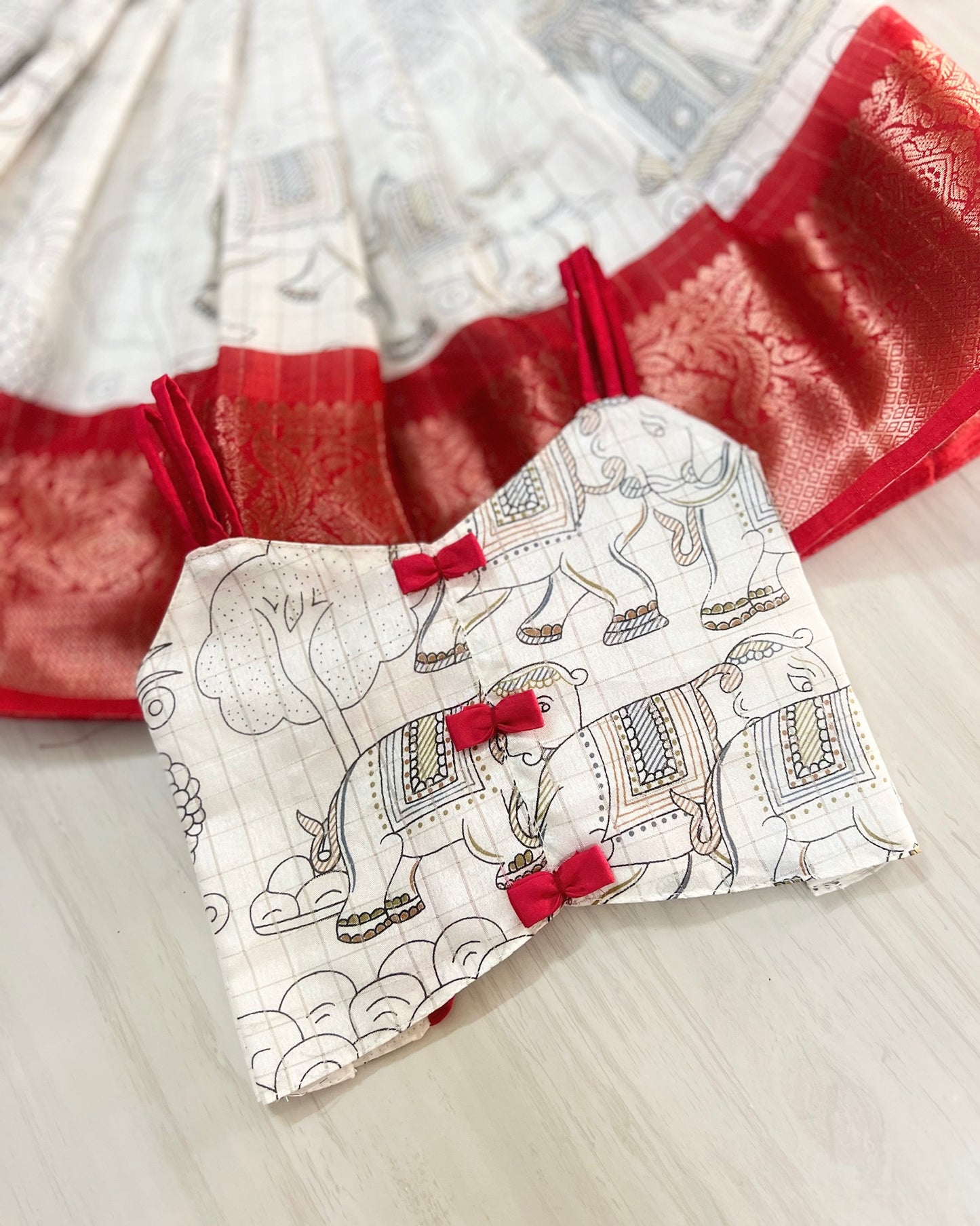 Porcelain White With Cute Red Bows Tie-Up Lehenga Set