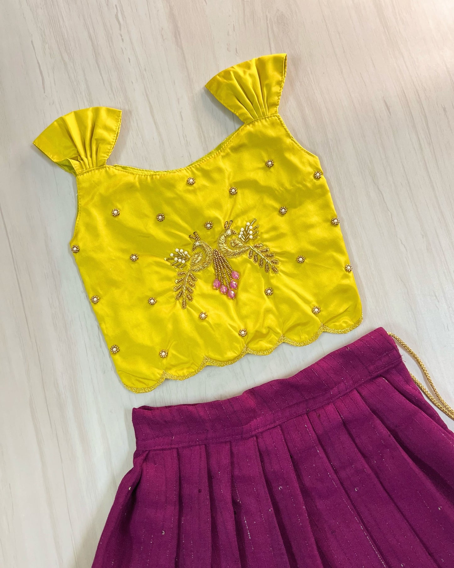 Saffron Yellow Peacock Embroidered Aari Work Cute Top With Plum Lehenga Set | The Silkberry