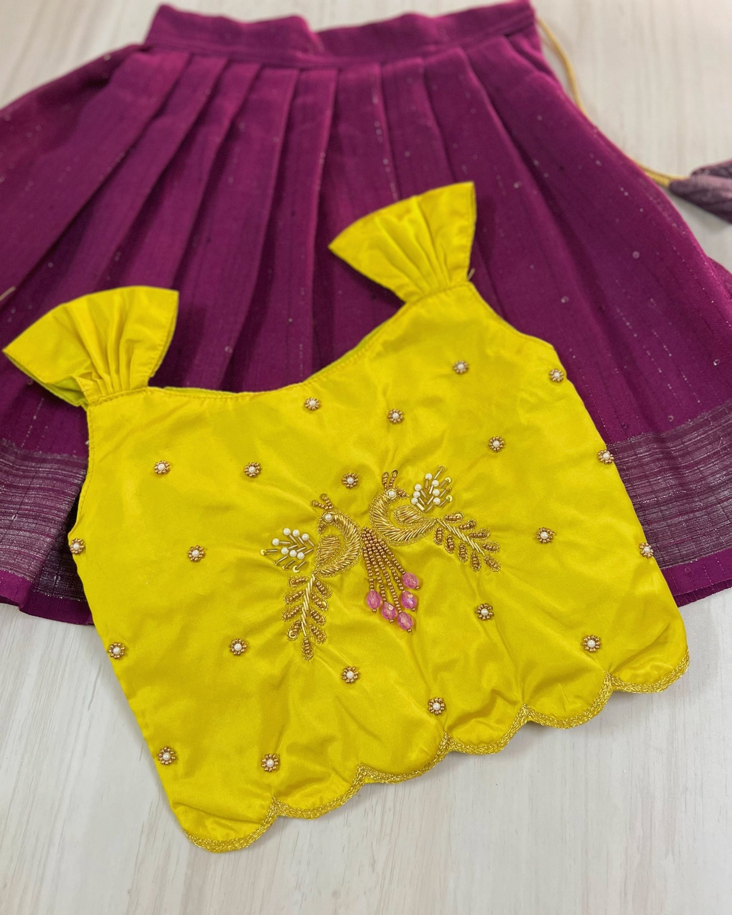 Saffron Yellow Peacock Embroidered Aari Work Cute Top With Plum Lehenga Set | The Silkberry