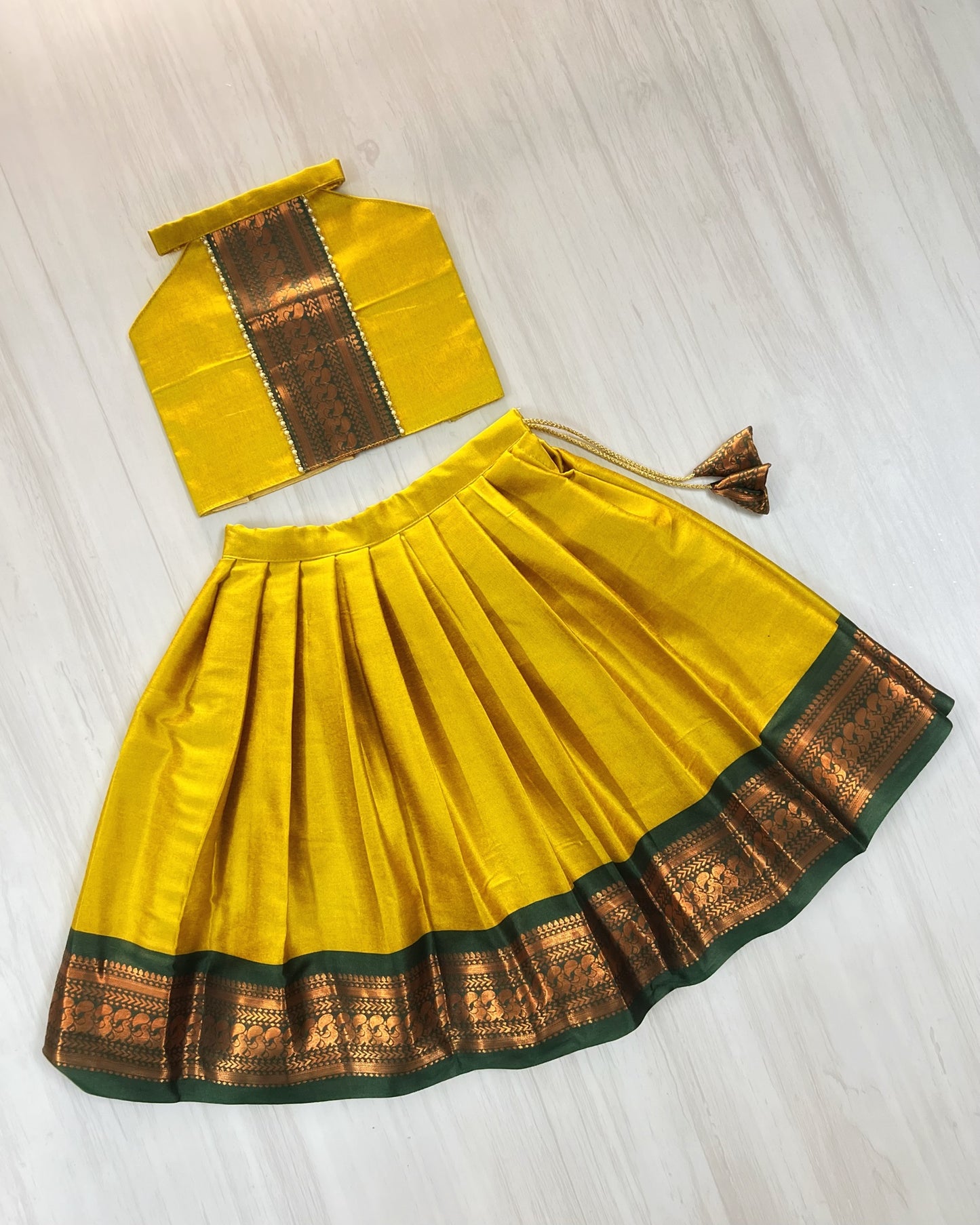 Auspicious Yellow With Emerald Green Halter Neck Lehenga Set