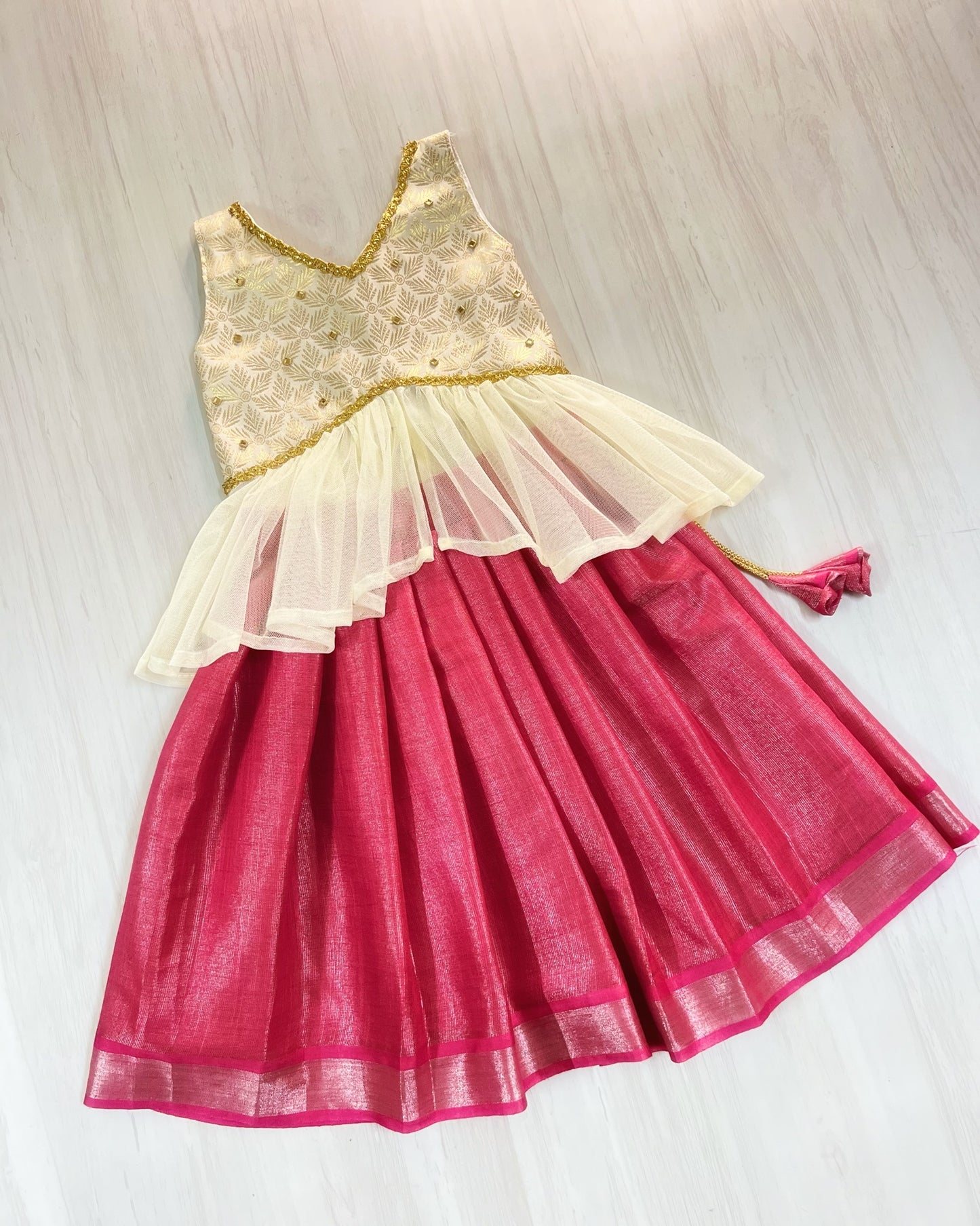 Rich Brocade Gold And Pink Netted Unique Lehenga Set